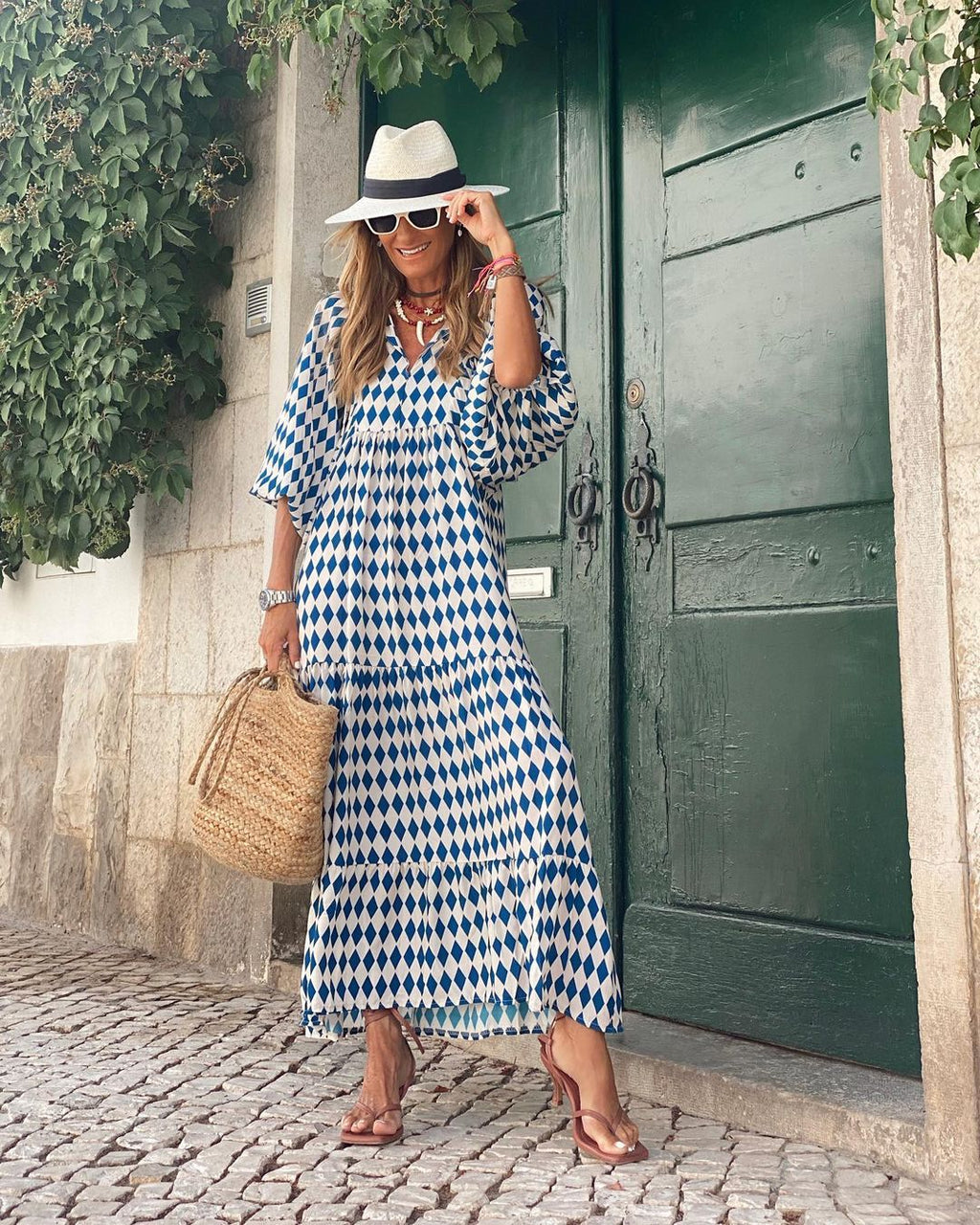 Lightweight floral-print summer dress with an airy, relaxed drape.