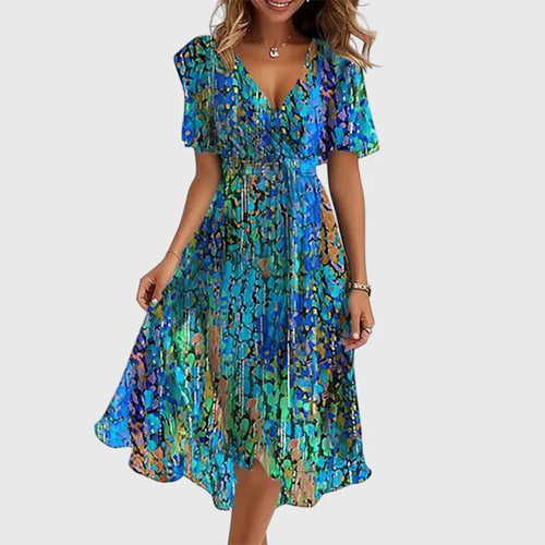 Breezy midi dress with a wrap-effect V-neckline, cinched waist and flutter sleeves.