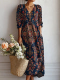 Everyday dress with a smooth, flowing drape, long sleeves and a polished neckline.