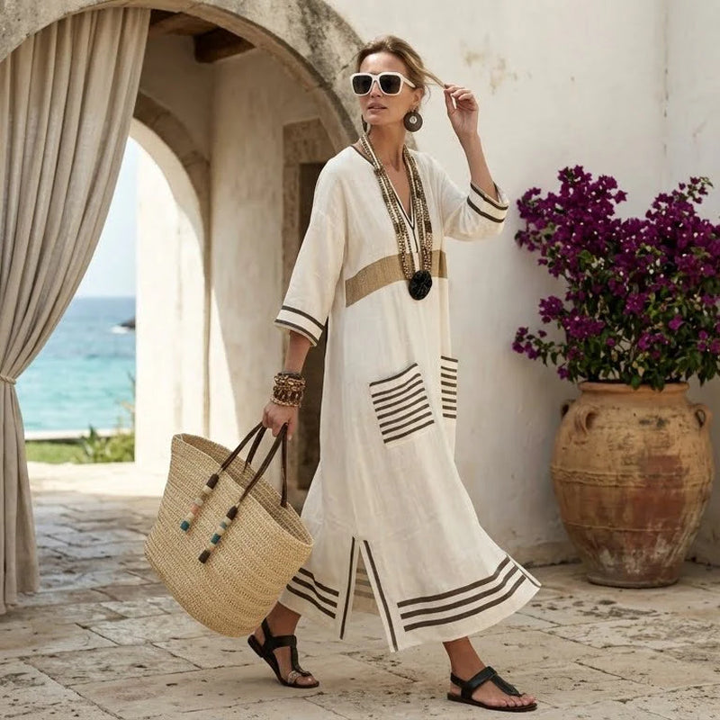 Easy summer dress with practical side pockets and a slight stretch.