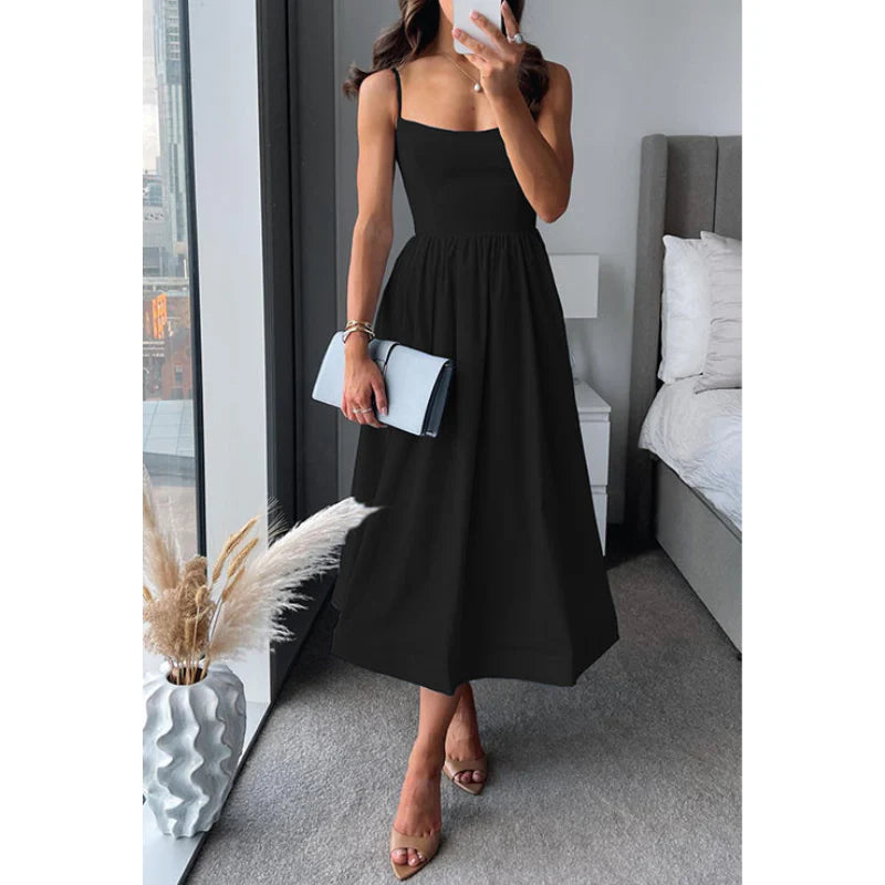 Graceful midi dress with fine straps and a light, easy drape.