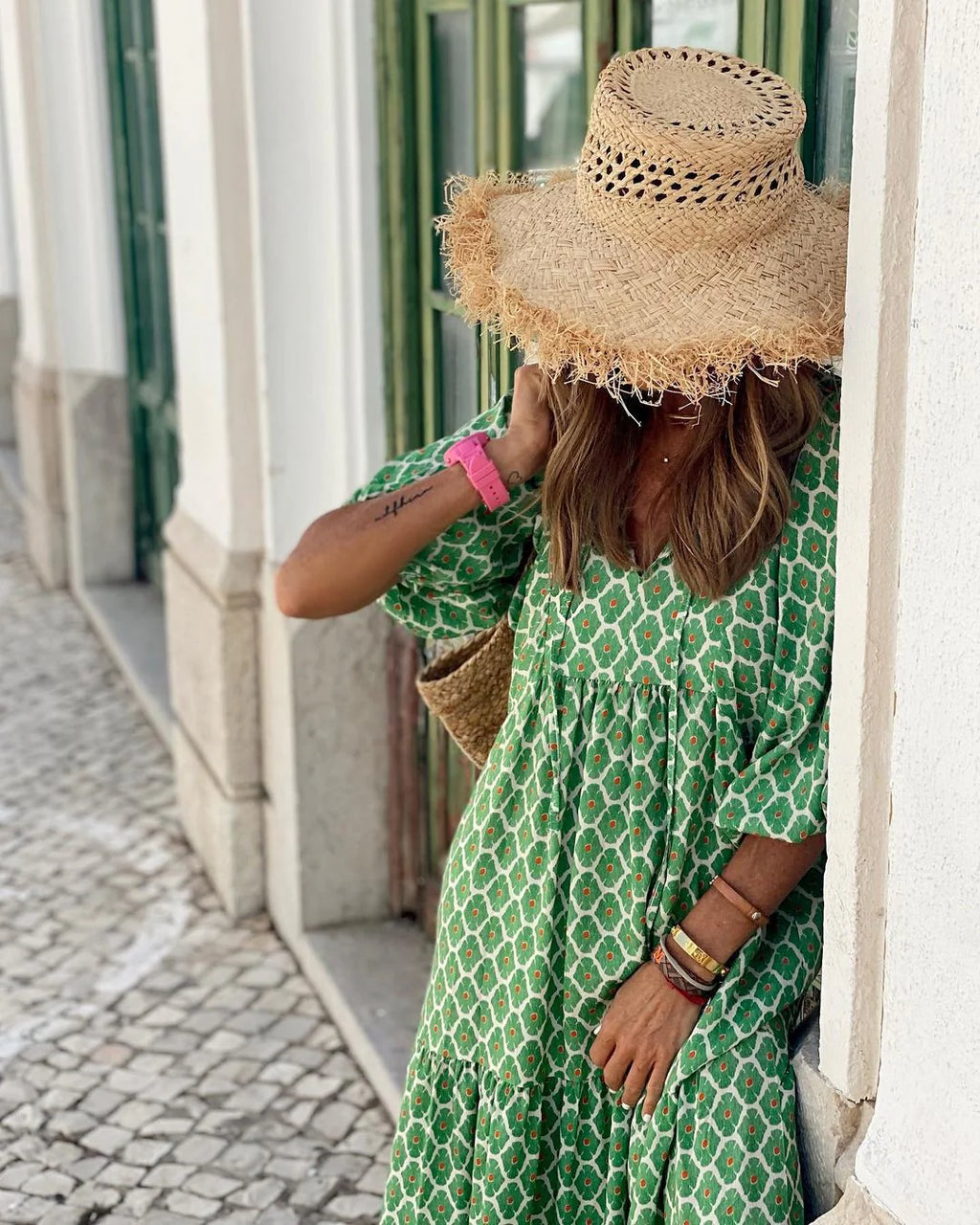 Lightweight floral-print summer dress with an airy, relaxed drape.