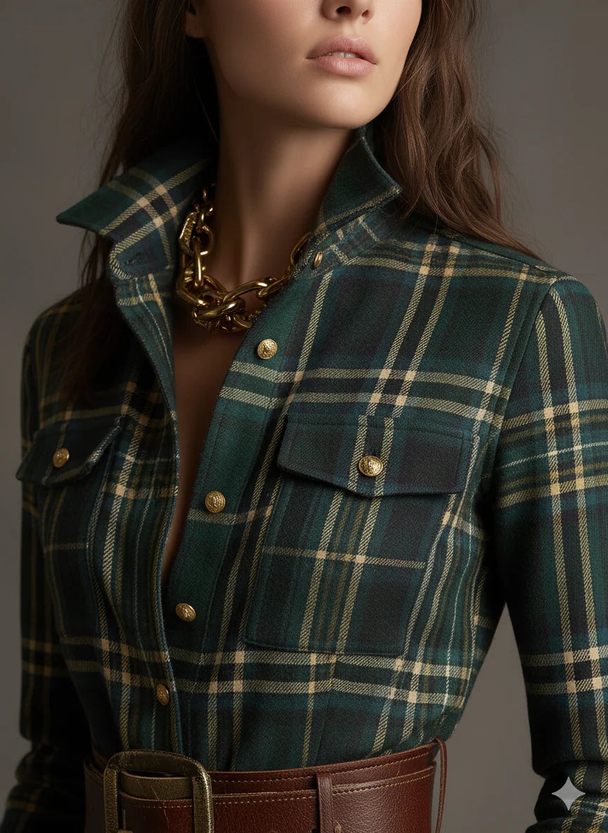 Plaid shirt dress with a button-up bodice, full flowing skirt and matching belt.