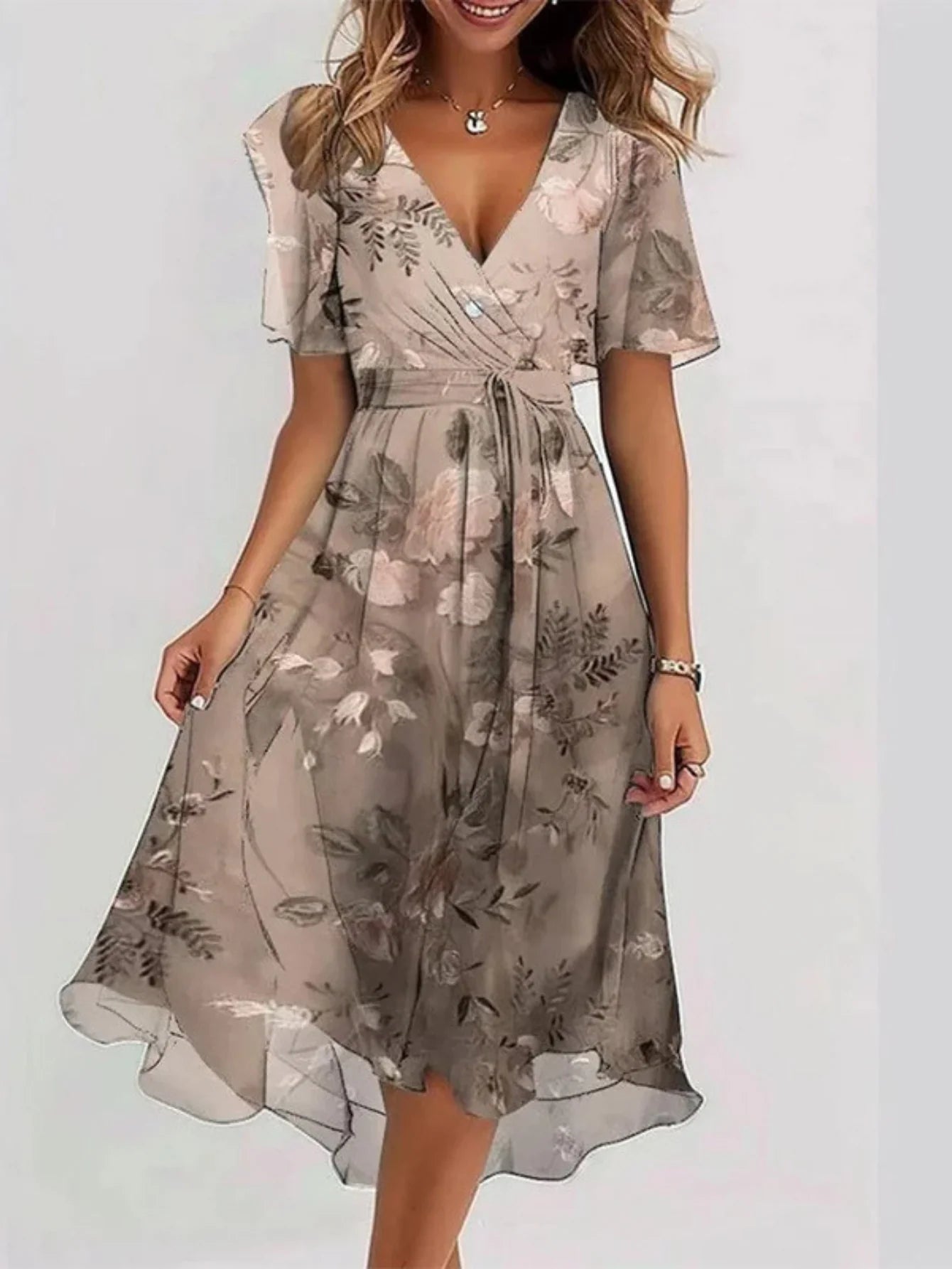 Relaxed summer dress with a light, feminine drape.