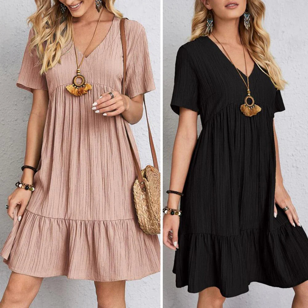 Elegant dress with soft layered detailing and a gently draped waist.