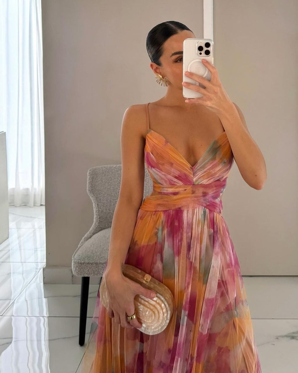 Fluid, romantic dress in a semi-sheer, lightweight construction.