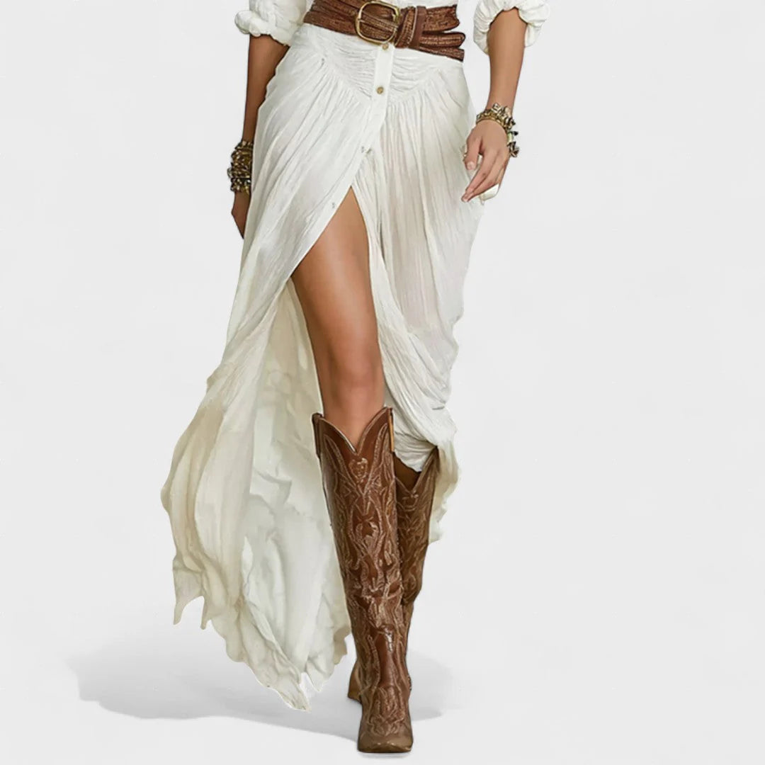 Flowing shirt dress with a cinched waist and fluid movement.