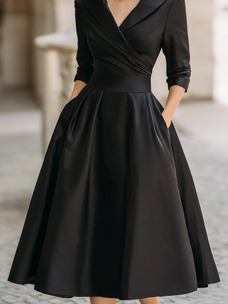 Draped-neckline dress with a fitted bodice, A-line skirt and hidden side pockets.