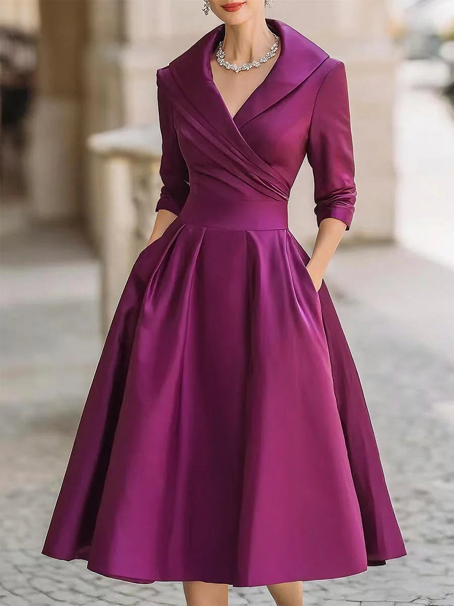 Draped-neckline dress with a fitted bodice, A-line skirt and hidden side pockets.