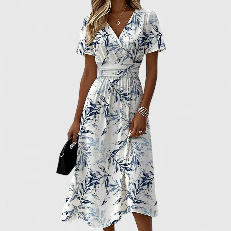 Lightweight dress with a classic V-neckline and a graceful, timeless line.
