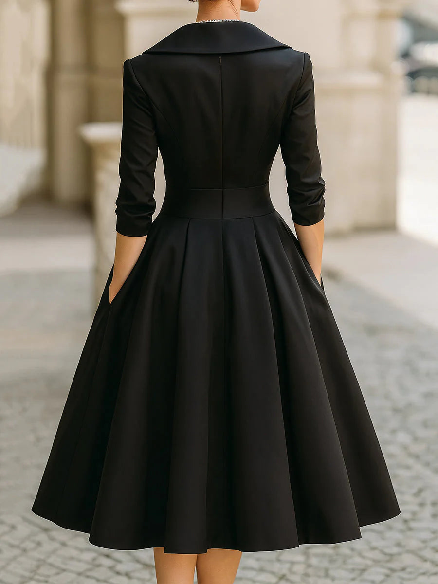 Draped-neckline dress with a fitted bodice, A-line skirt and hidden side pockets.