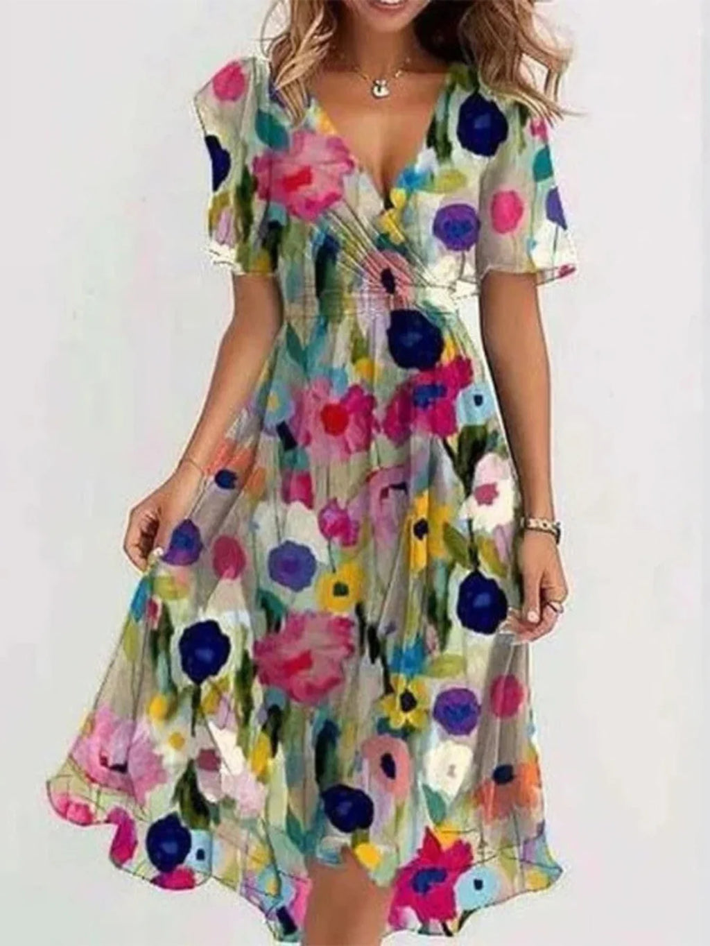 Relaxed summer dress with a light, feminine drape.