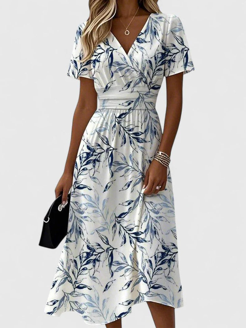 Lightweight dress with a classic V-neckline and a graceful, timeless line.