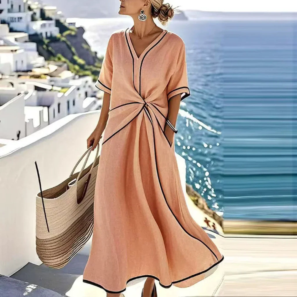 Softly woven dress with draped waist detail and a clean V-neckline.