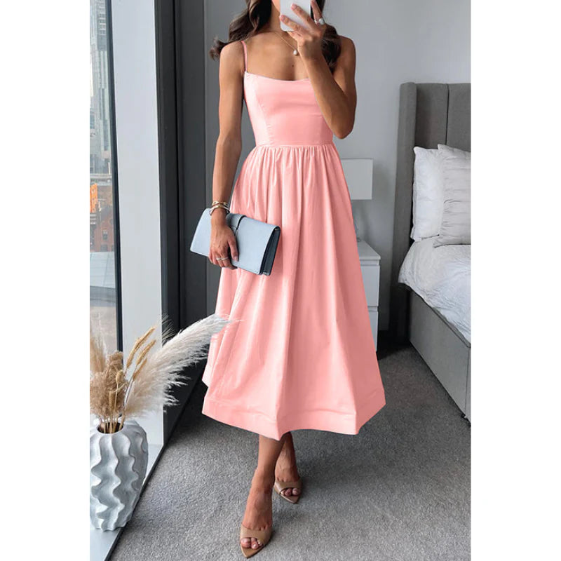 Graceful midi dress with fine straps and a light, easy drape.