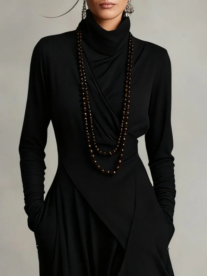 Refined boho maxi dress with a soft V-neck, long sleeves and fluid full-length line.