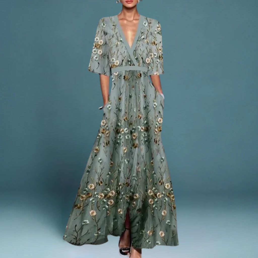 Elegant wrap-front maxi dress with a defined waist and a sweeping skirt.