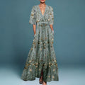 Elegant wrap-front maxi dress with a defined waist and a sweeping skirt.