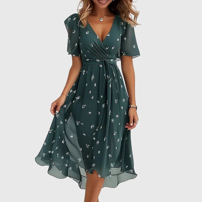 Breezy midi dress with a wrap-effect V-neckline, cinched waist and flutter sleeves.