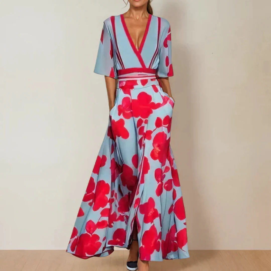 Elegant wrap-front maxi dress with a defined waist and a sweeping skirt.