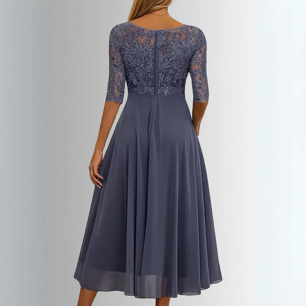 Occasion dress with a delicate lace bodice and a layered, feather-light skirt.