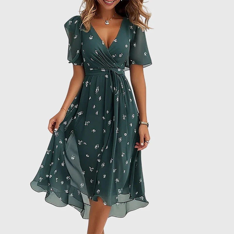 Breezy midi dress with a wrap-effect V-neckline, cinched waist and flutter sleeves.