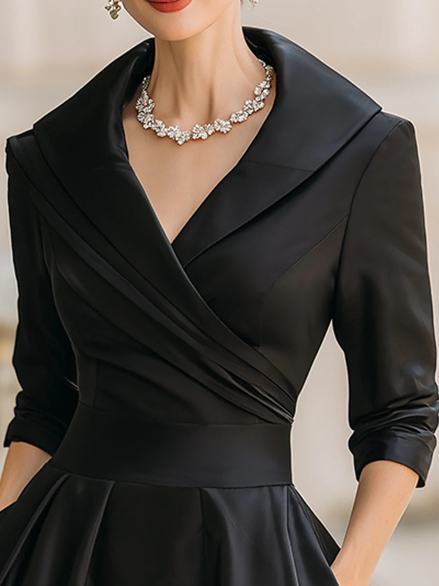 Draped-neckline dress with a fitted bodice, A-line skirt and hidden side pockets.