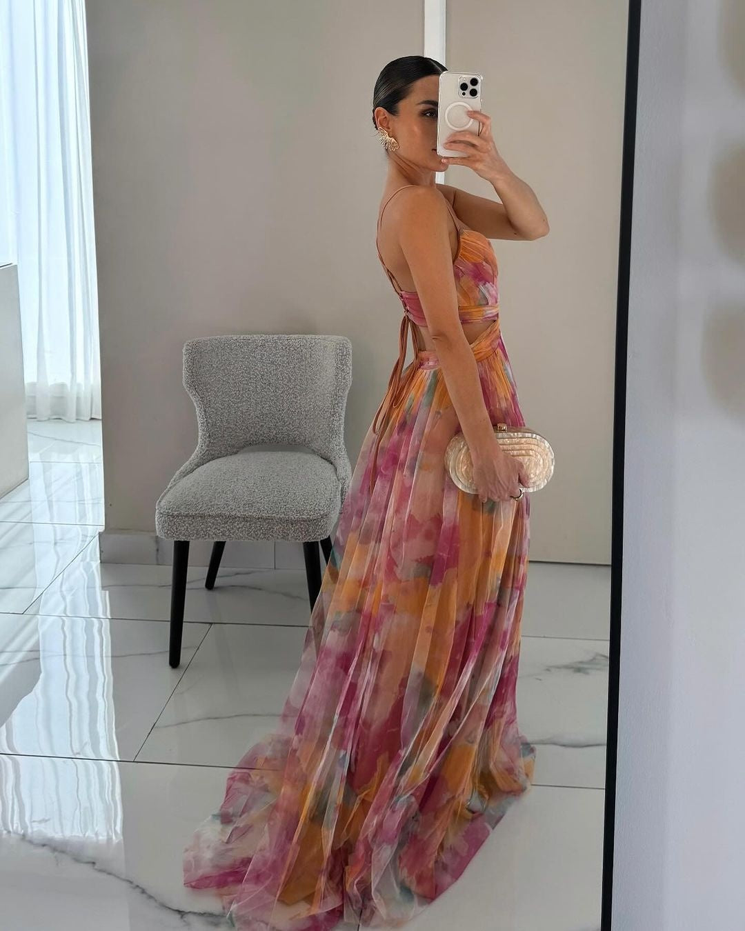 Fluid, romantic dress in a semi-sheer, lightweight construction.