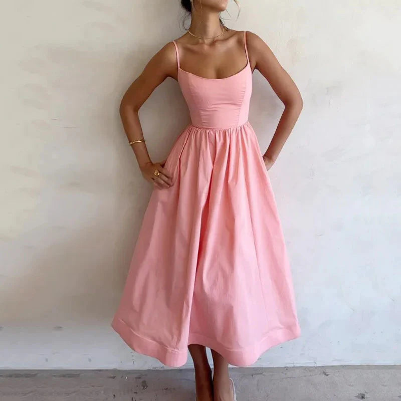 Graceful midi dress with fine straps and a light, easy drape.