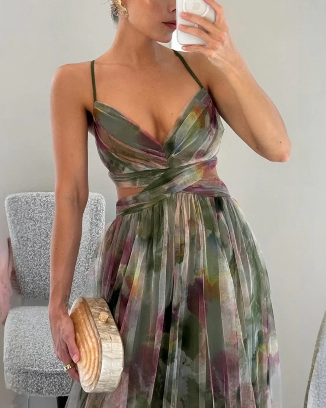 Fluid, romantic dress in a semi-sheer, lightweight construction.