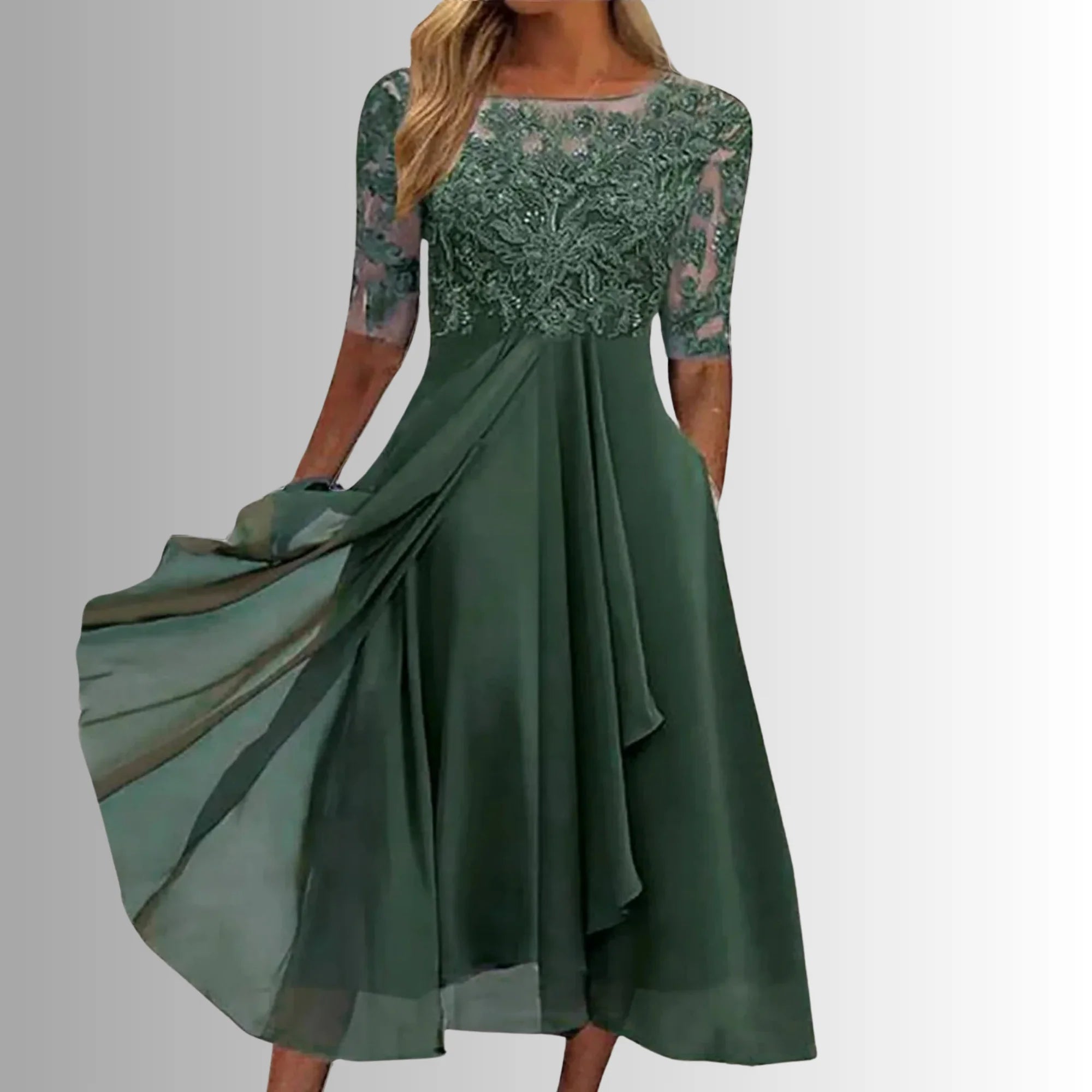 Occasion dress with a delicate lace bodice and a layered, feather-light skirt.