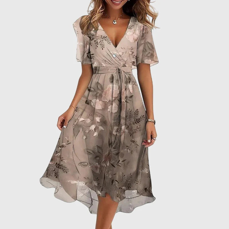 Breezy midi dress with a wrap-effect V-neckline, cinched waist and flutter sleeves.