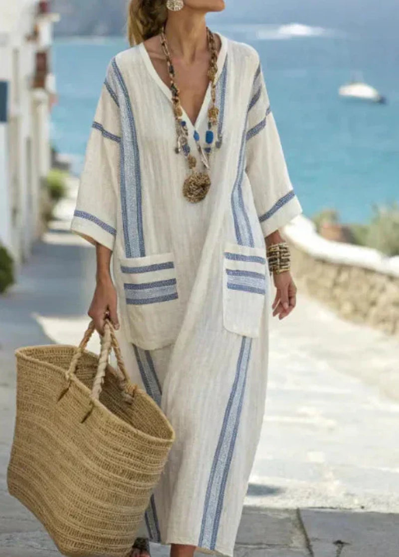 Soft woven-blend summer maxi dress with a relaxed, flowing line.