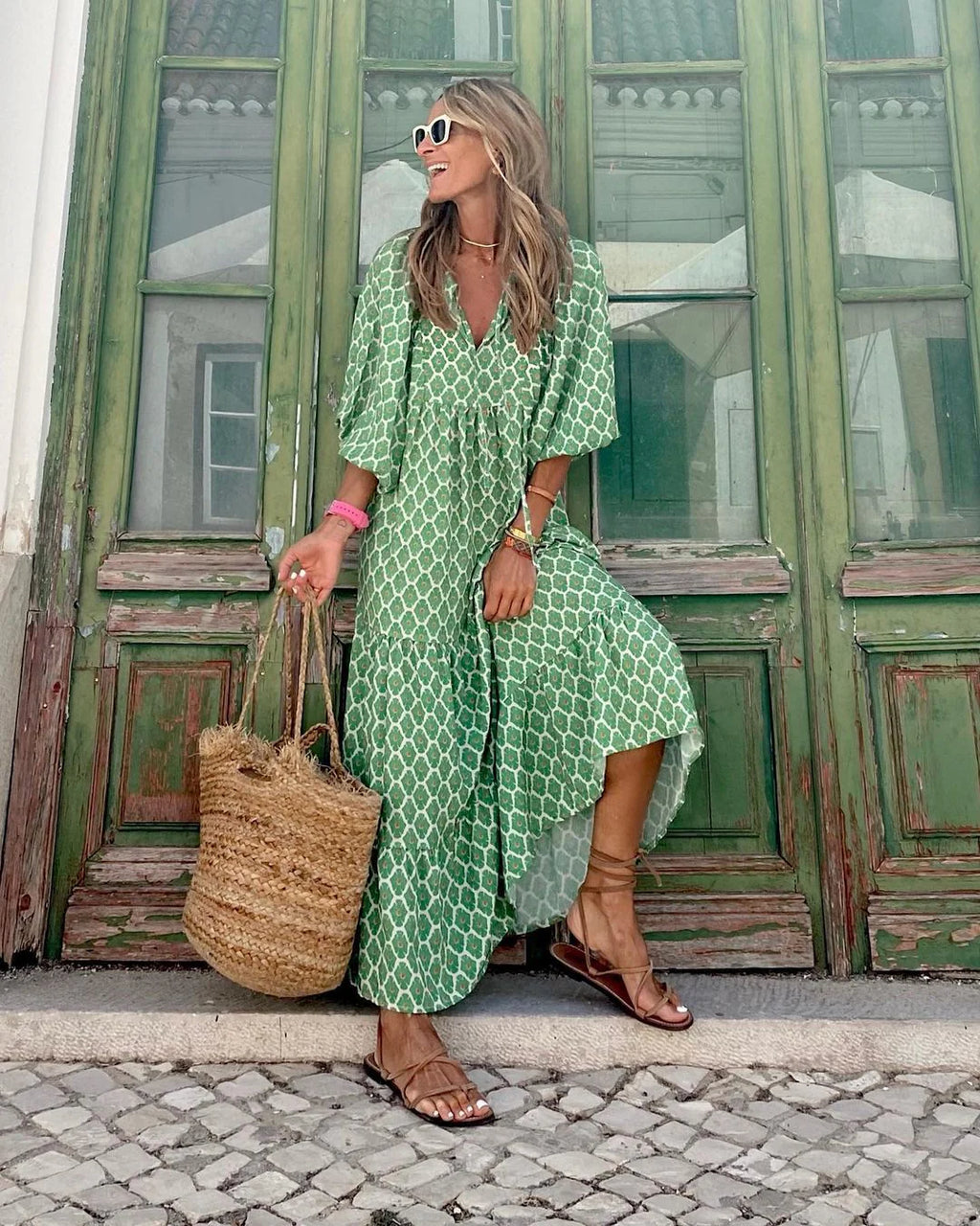 Lightweight floral-print summer dress with an airy, relaxed drape.