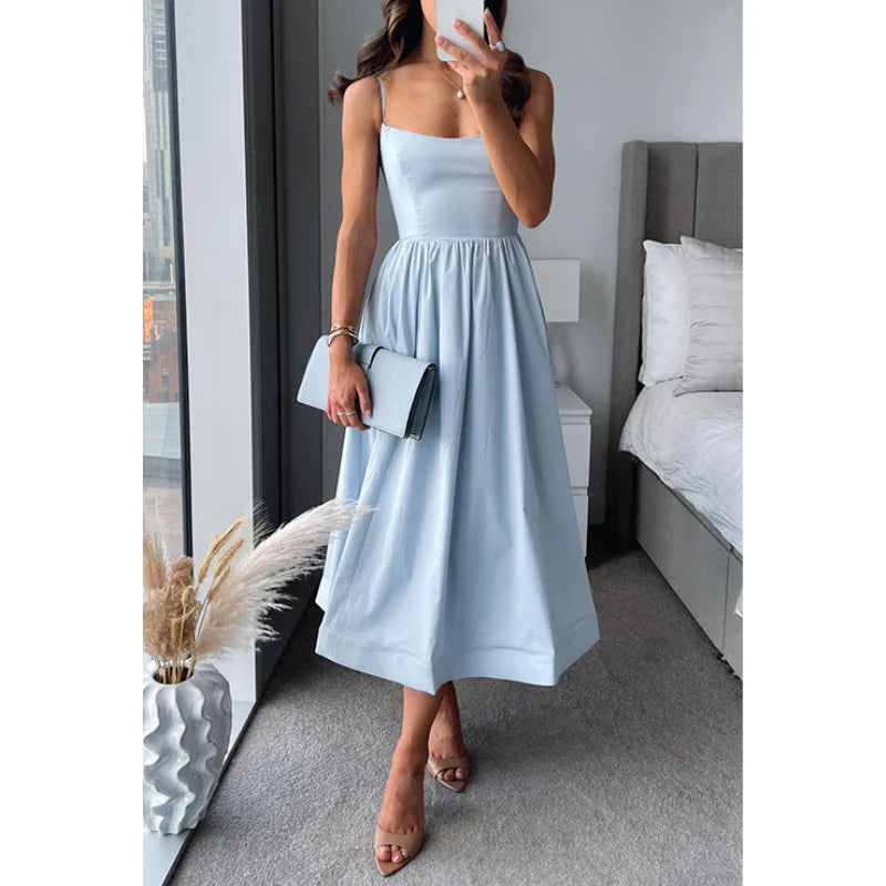 Graceful midi dress with fine straps and a light, easy drape.