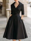 Draped-neckline dress with a fitted bodice, A-line skirt and hidden side pockets.
