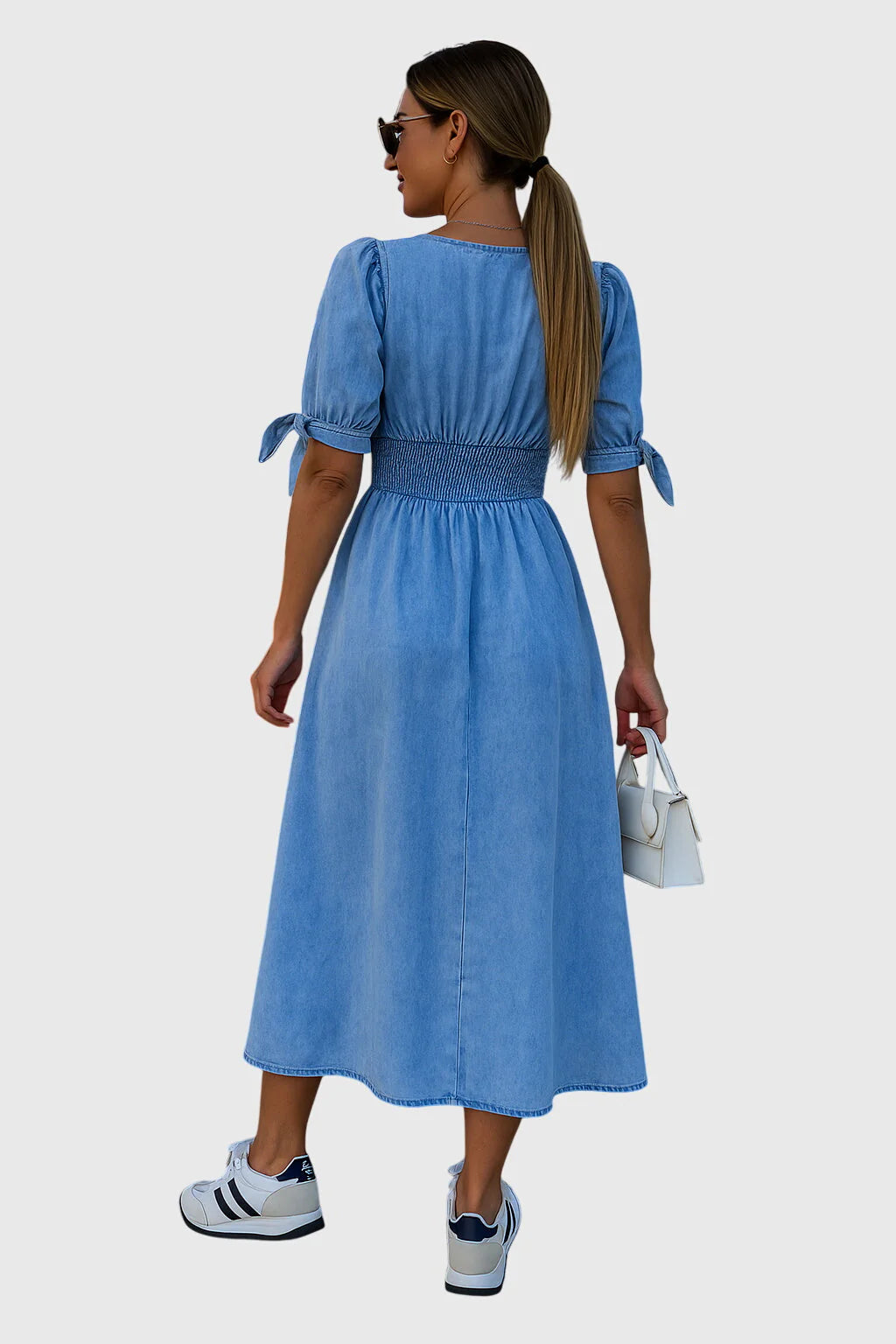 Elevated denim dress with a tailored waist and easy all-day line.