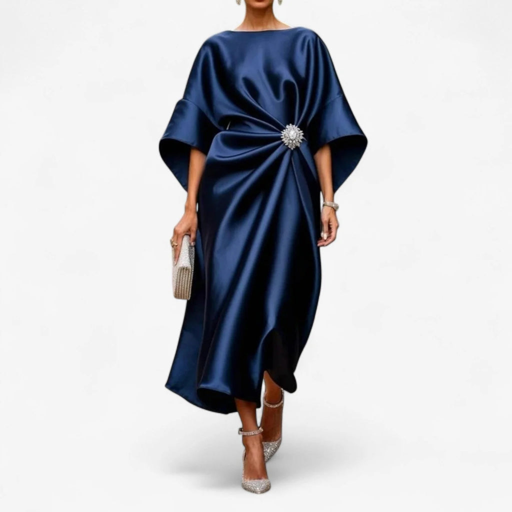 Draped dress in a fluid, satin-like fabric with a gathered waist accent.