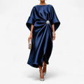 Draped dress in a fluid, satin-like fabric with a gathered waist accent.