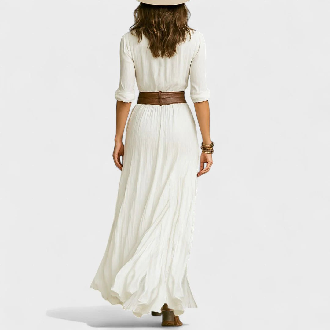 Flowing shirt dress with a cinched waist and fluid movement.